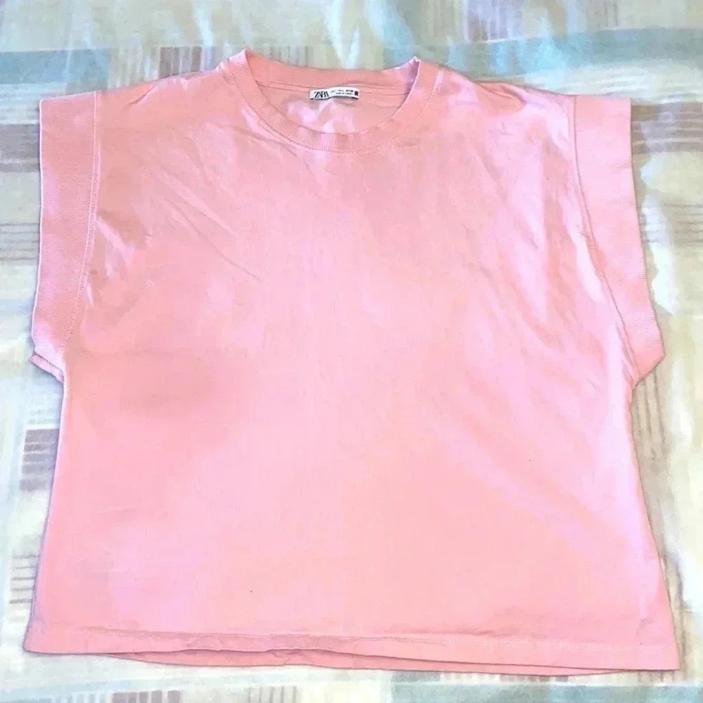 Pink Top by  Zara with widely opened arms areas